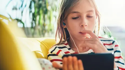 Getty Images Child and mobile device (stock image)