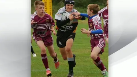 family handout Evan Hawksworth playing rugby