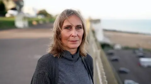 Patricia Stanley on the beach her son Sammy loved