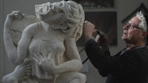 PA Media Cheese-roller gargoyle