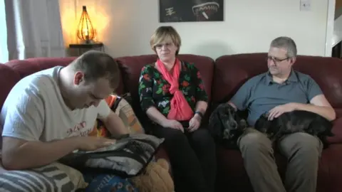 BBC Marcus Moore with his parents