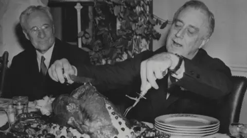 Franklin D Roosevelt Library / National Archives President Franklin D. Roosevelt Carving the Thanksgiving Turkey