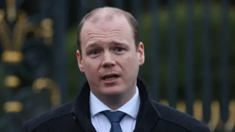 PA Media Communities Minister Gordon Lyons