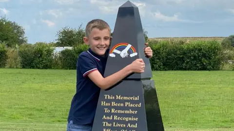 BBC Jake with his Covid-19 memorial obelisk