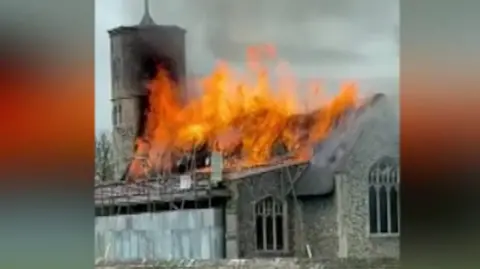 Eleven fire crews were called to tackle the flames, which ripped through a thatched roof.