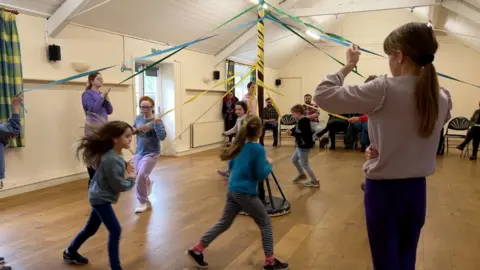 A group of children dancing