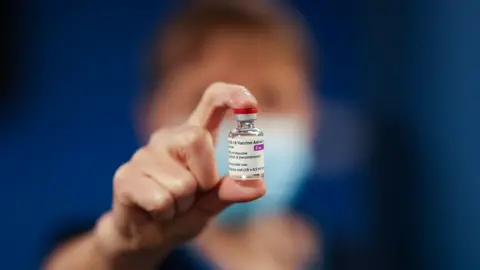 Nurse holding vaccine