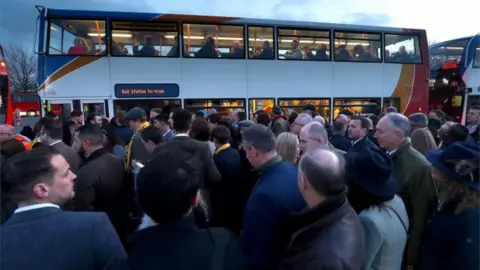 Reuters People using buses at the festival