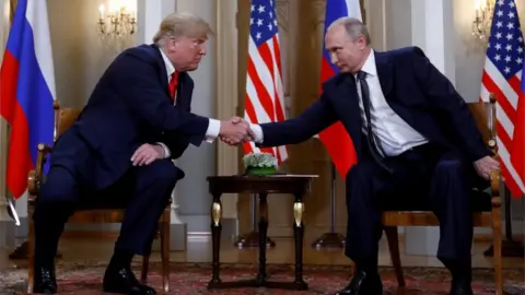 Reuters Trump and Putin shake hands at the Helsinki summit