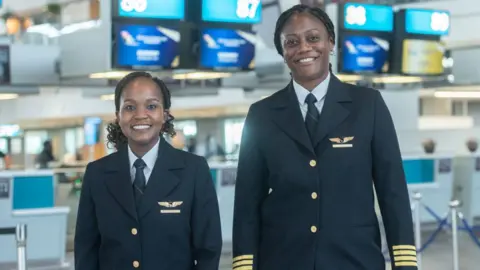 Getty Images First Officer Refilwe Moreetsi and Captain Annabel Vundla at a media briefing of the first black African female flight deck crew at Cape Town International Airport on October 25, 2022