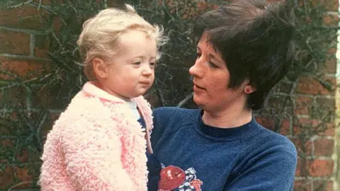 PA Media Barbara Palmer holding baby Lauren Palmer