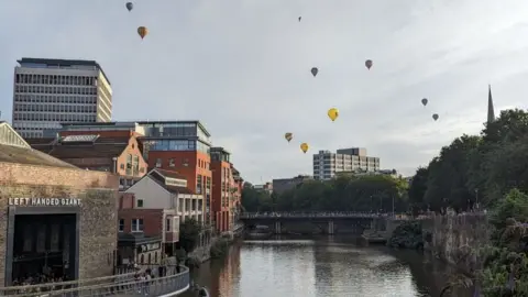 BBC Balloons in the sky above Bristol city centre