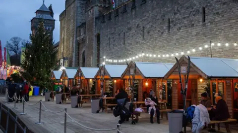 Getty Images People enjoying a drink in Cardiff