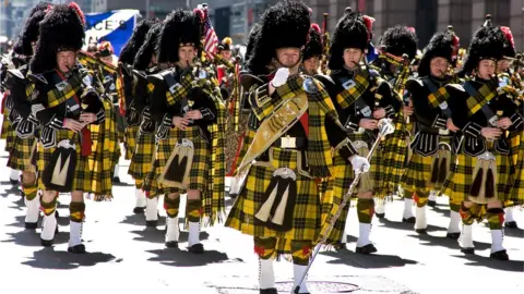 Getty Images Pipe band marches in Tartan Day parade