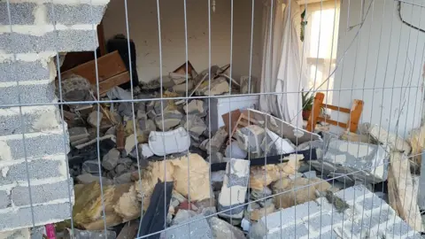 Family handout The destroyed dining room