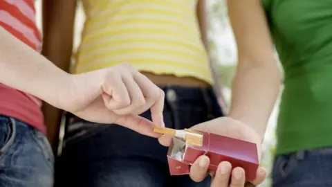 Science Photo Library Smoking teenagers