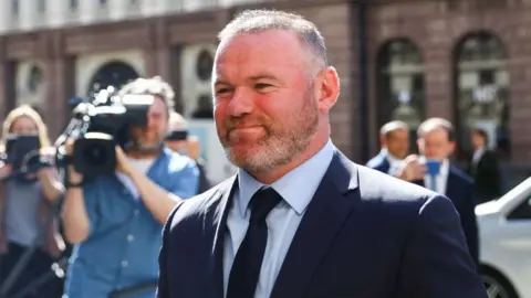 Reuters Wayne Rooney arriving at court on Tuesday