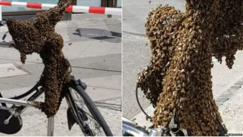 Berlin Police Bicycle covered by a bee swarm