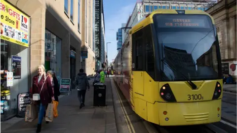 Getty Images The Metrolink tram system in Greater Manchester is one scheme that could benefit