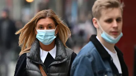 Getty Images Shoppers in Cardiff wearing face masks