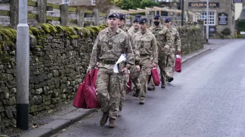 PA Media Soldiers in St John's Chapel, Weardale, County Durham