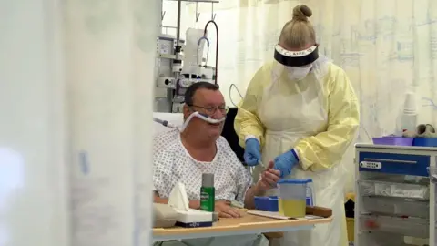 BBC A nurse treats Brian in ICU