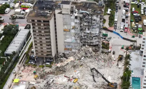 Getty Images An aerial view of the site during a rescue operation of the Champlain Tower partially collapsed in Surfside, Florida, 1 July 2021