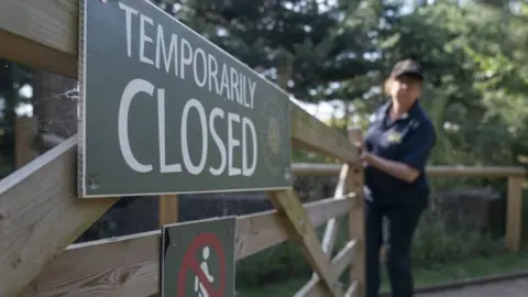 PA Media Wooden gate with temporary closure sign