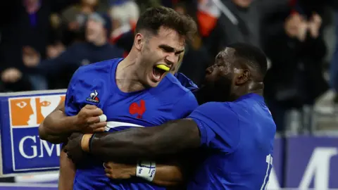 France winger Damian Penaud celebrates with team-mates