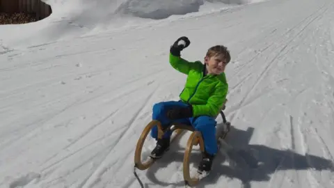Karen Newell Fred on a sledge