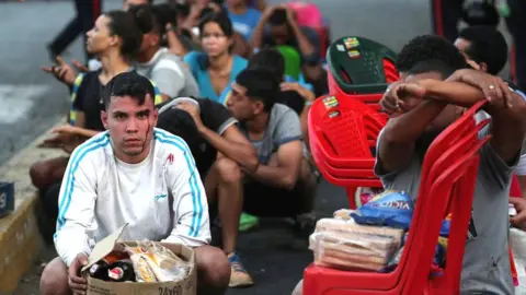 Reuters Looters detained by police