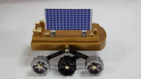 Getty Images Scale models of the Indian moon shot on display at the head quarters of the Indian Space Research Organisation (ISRO)