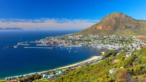 Getty Images Simon's Town, home to the South African Navy, with the well-known Boulders Beach and its colony of African penguins here since 1985, South Africa