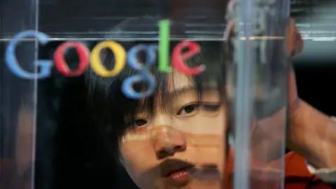 Getty Images woman polishing Google sign