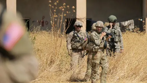 Reuters US and Turkish troops on a joint patrol near Tal Abyad, 8 September