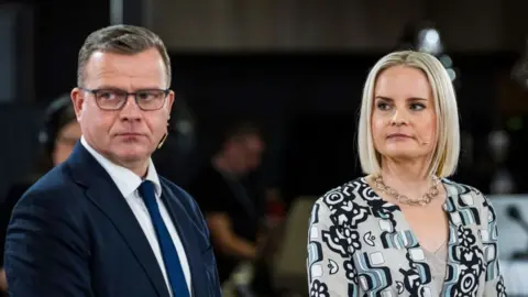 National Coalition Party chair Petteri Orpo (L) and Finns Party leader Riikka Purra