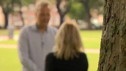BBC Anonymous domestic abuse victim talking to BBC reporter