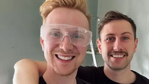 Owain Wyn Evans / Instagram Owain and his husband Aaron decorating