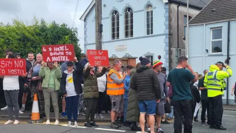 Protesters outside the site