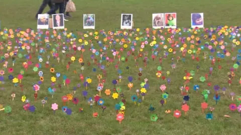 BBC Hand made flowers representing the thousands of people who have died of a drugs overdose in the UK