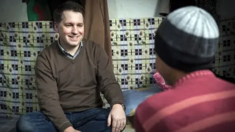 Save the Children Justin Forsyth on Syrian border with refugee