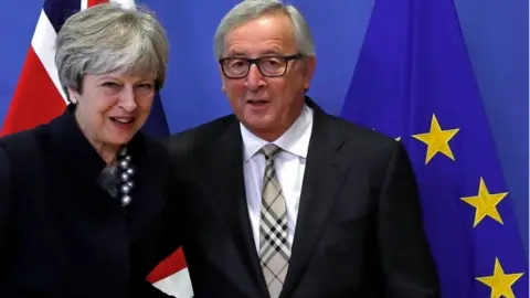 Reuters Theresa May and Jean-Claude Juncker