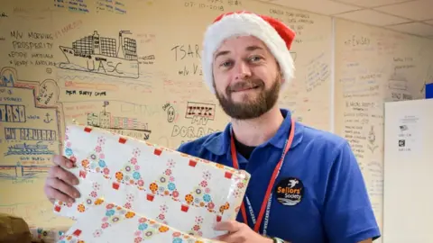 Sailors' Society Simon Mobsby wrapping presents