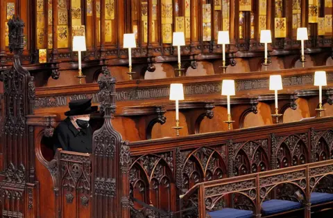 Jonathan Brady Queen Elizabeth II takes her seat for the funeral of the Duke of Edinburgh