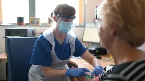 Getty Images A nurse wears personal protective equipment