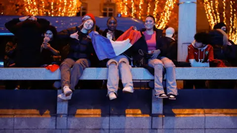Getty Images Excited fans in Paris