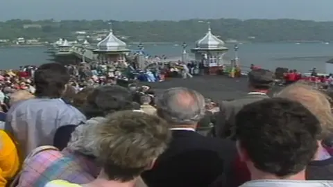 people looking at the pier at reopening in 1988