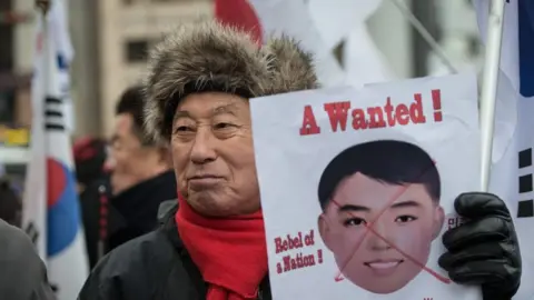 Getty Images Conservative groups in South Korea have protested against the masks