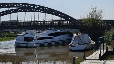 HM Coastguard Gorleston  Cruiser wedged under bridge at St Olaves