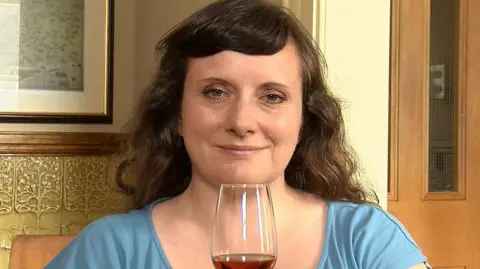 Amy Seton with a glass of whisky